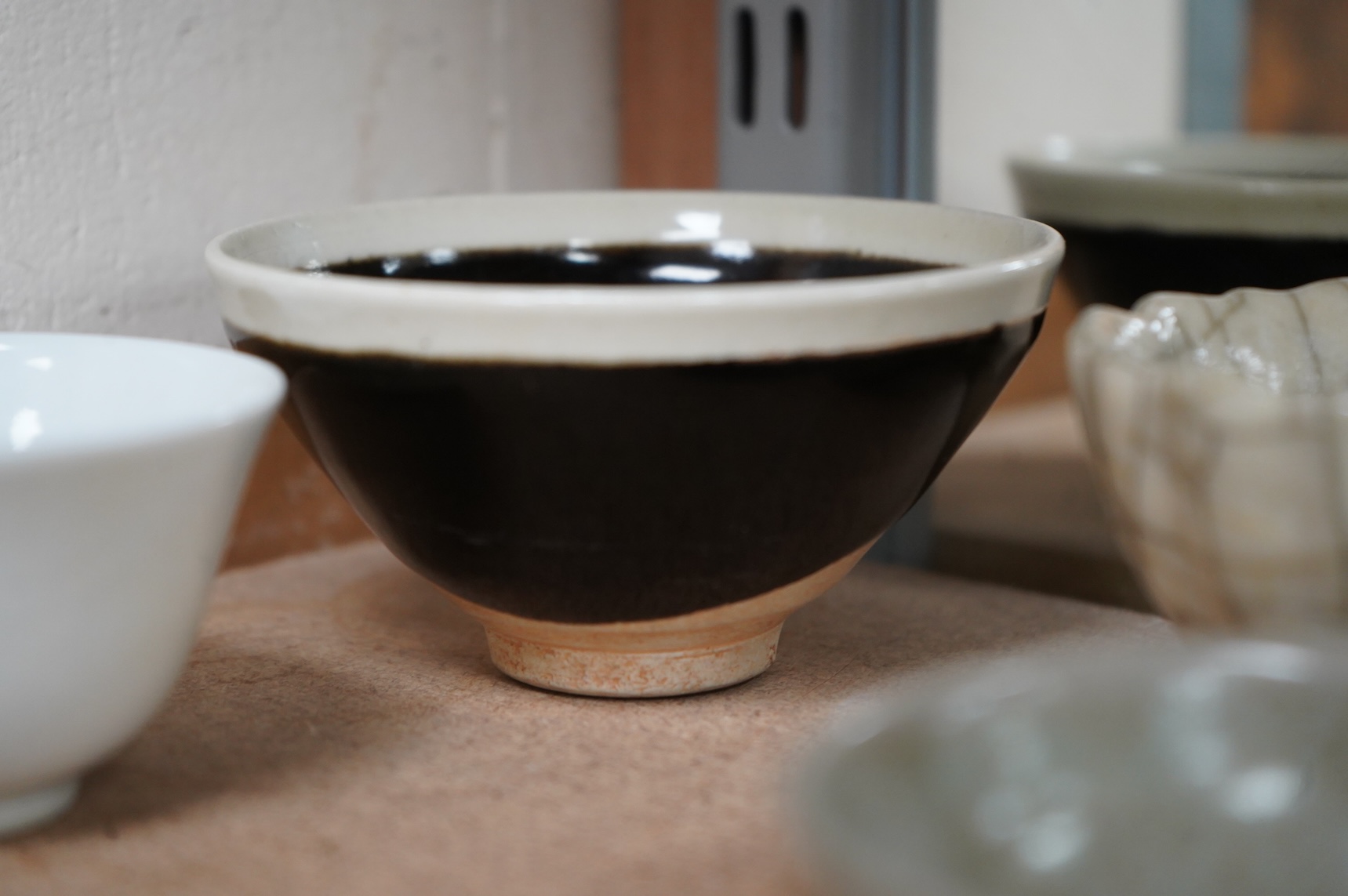 A collection of Chinese porcelain and pottery to include a naturalistic teapot, crackle glaze bowl and a ‘dragon’ bowl, largest 10cm in diameter